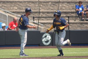 WVU gets back on track, tops Ball State 13-5 to stay alive in Lexington Regional